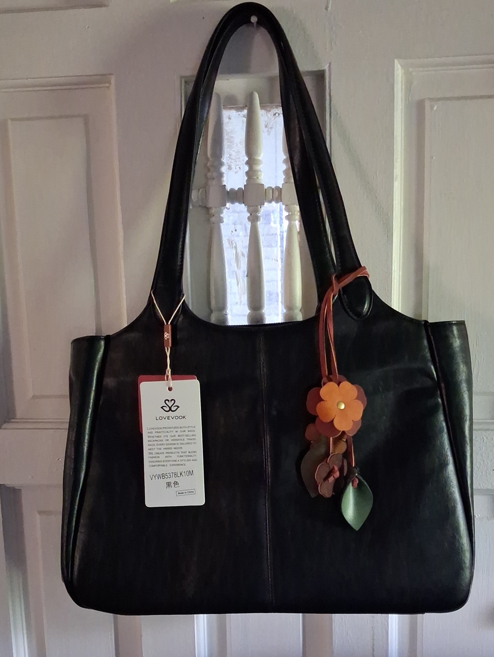 Black Leather Shoulder Bag with Floral Charm by LOVEVOOK